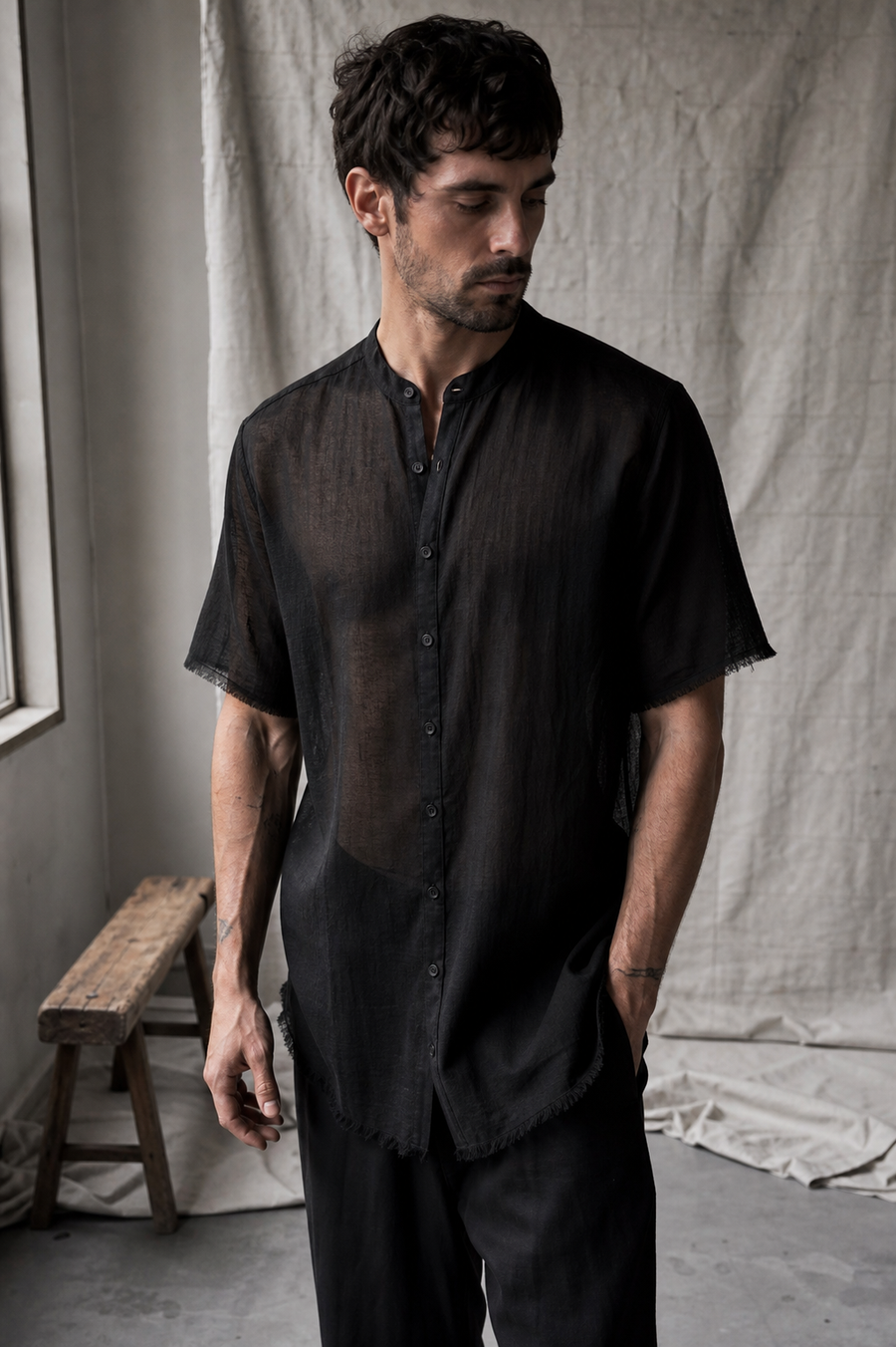 AITO Sheer Cotton Short-Sleeve Shirt in black — front view on model, band collar and buttoned placket