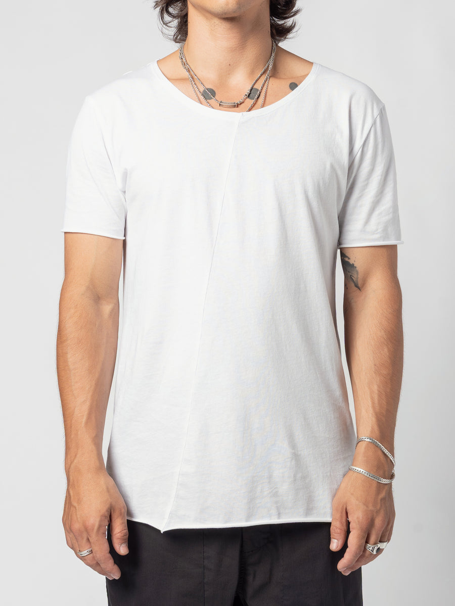 AITO Scoop Neck Cotton T-Shirt in White — front view of the torso, arms at the sides, the curved hem sitting over black trousers