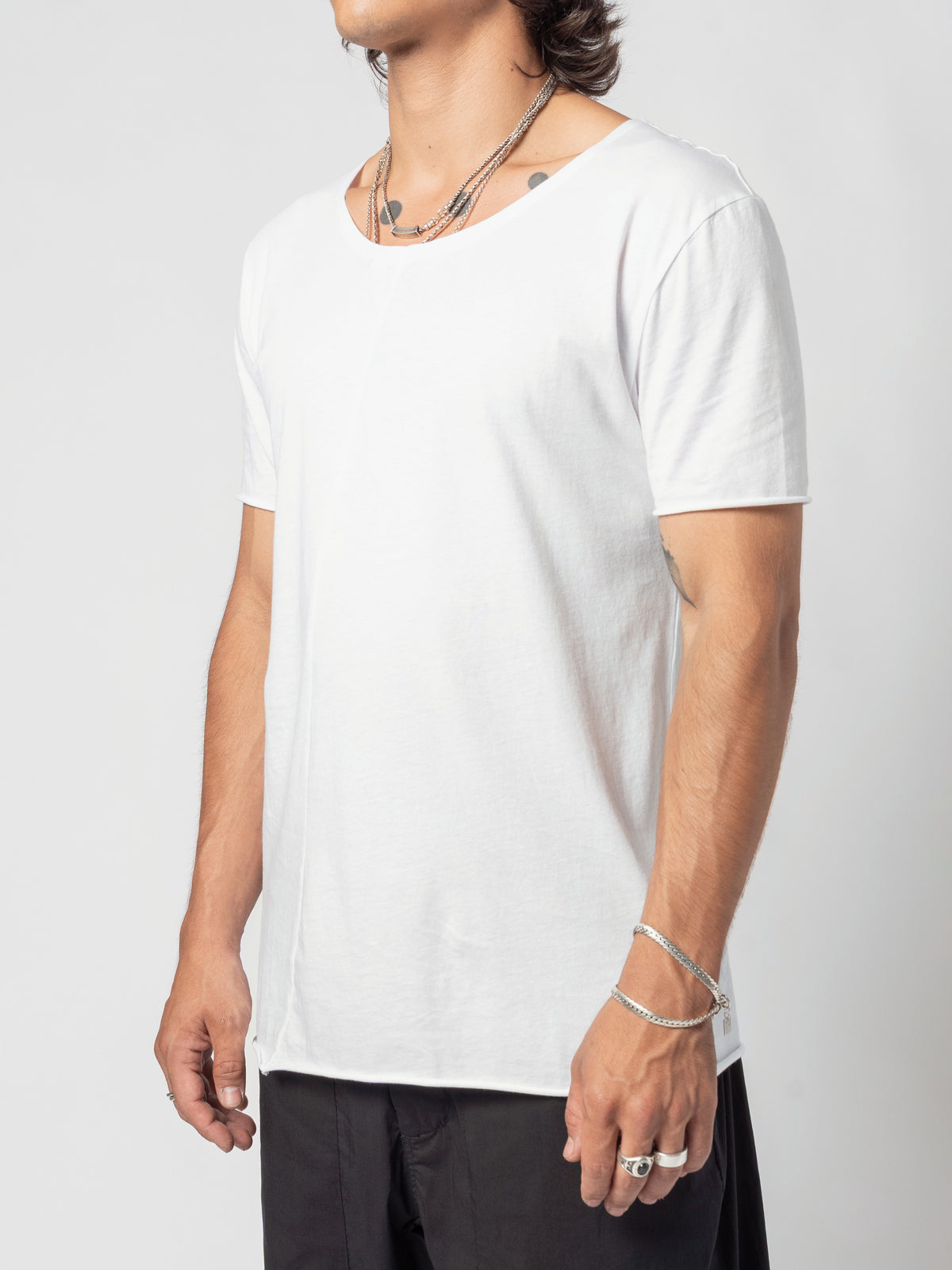 AITO Scoop Neck Cotton T-Shirt in White — side three-quarter with the shoulder nearest the camera, the neckline seen edge-on
