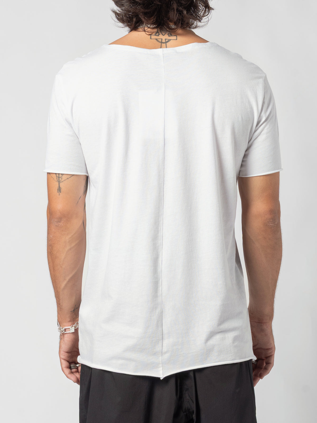 AITO Scoop Neck Cotton T-Shirt in White — back view of the torso, the centre-back seam and the stepped hem
