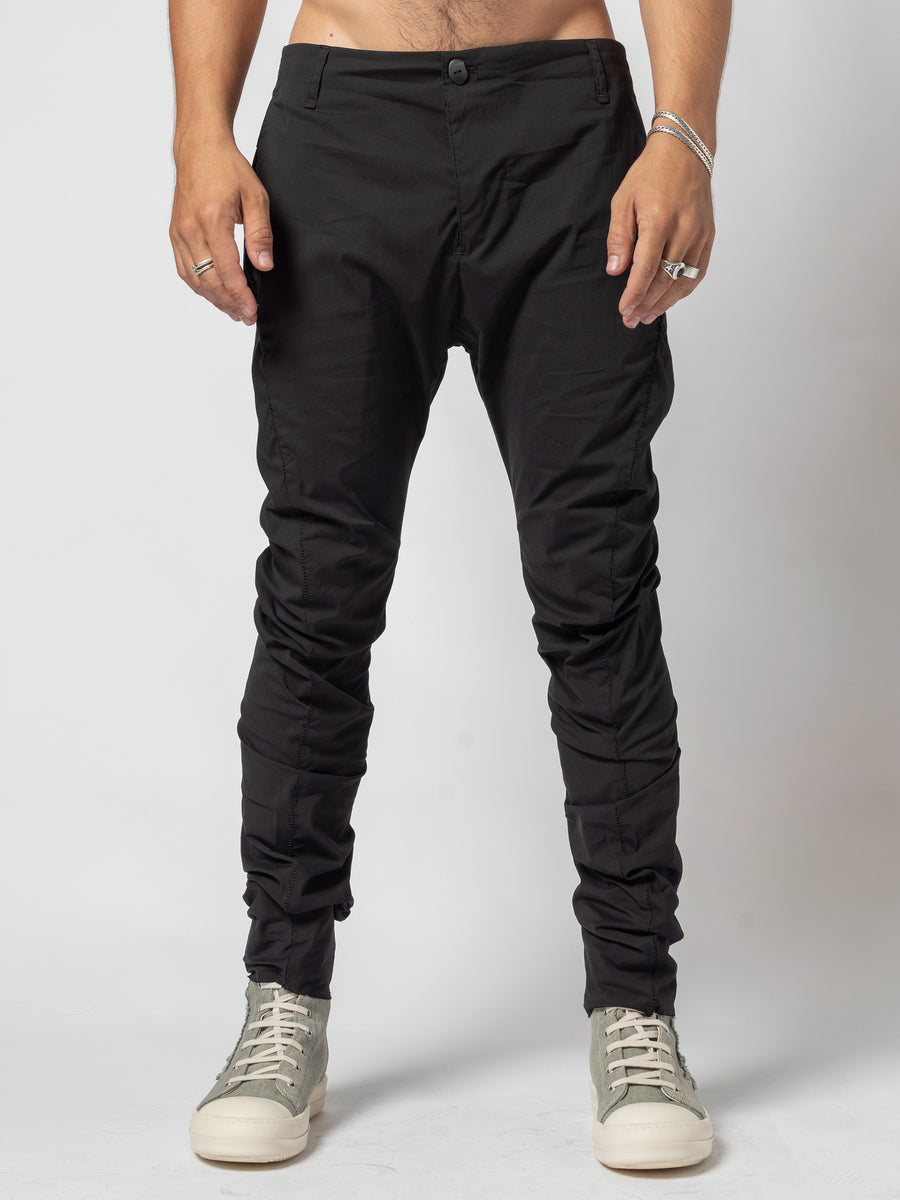 AITO Stacked Hem Slim Pants in Black — front view with the shirt off and the feet together, waistband and fly seen straight on