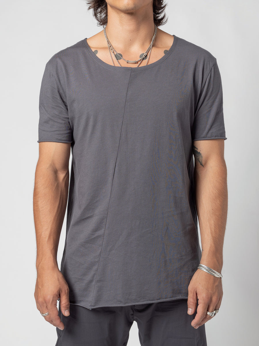 AITO Scoop Neck Cotton T-Shirt in Grey — front view from the hips up, arms at the sides and the curved hem falling over the trousers