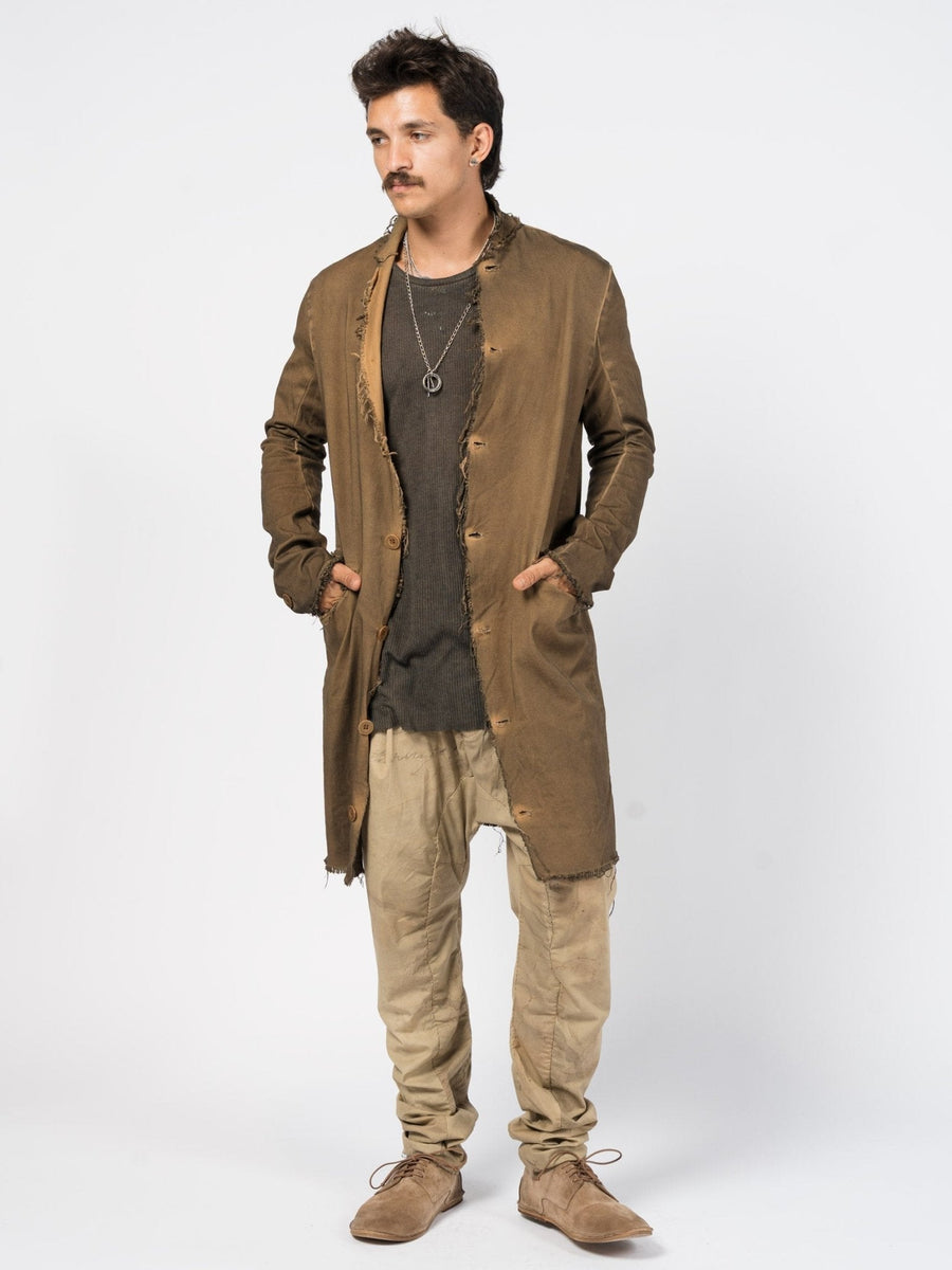AITO Frayed Edge Cotton Coat in Militare — front view worn open over a ribbed tank, hands in pockets, showing the longline cut