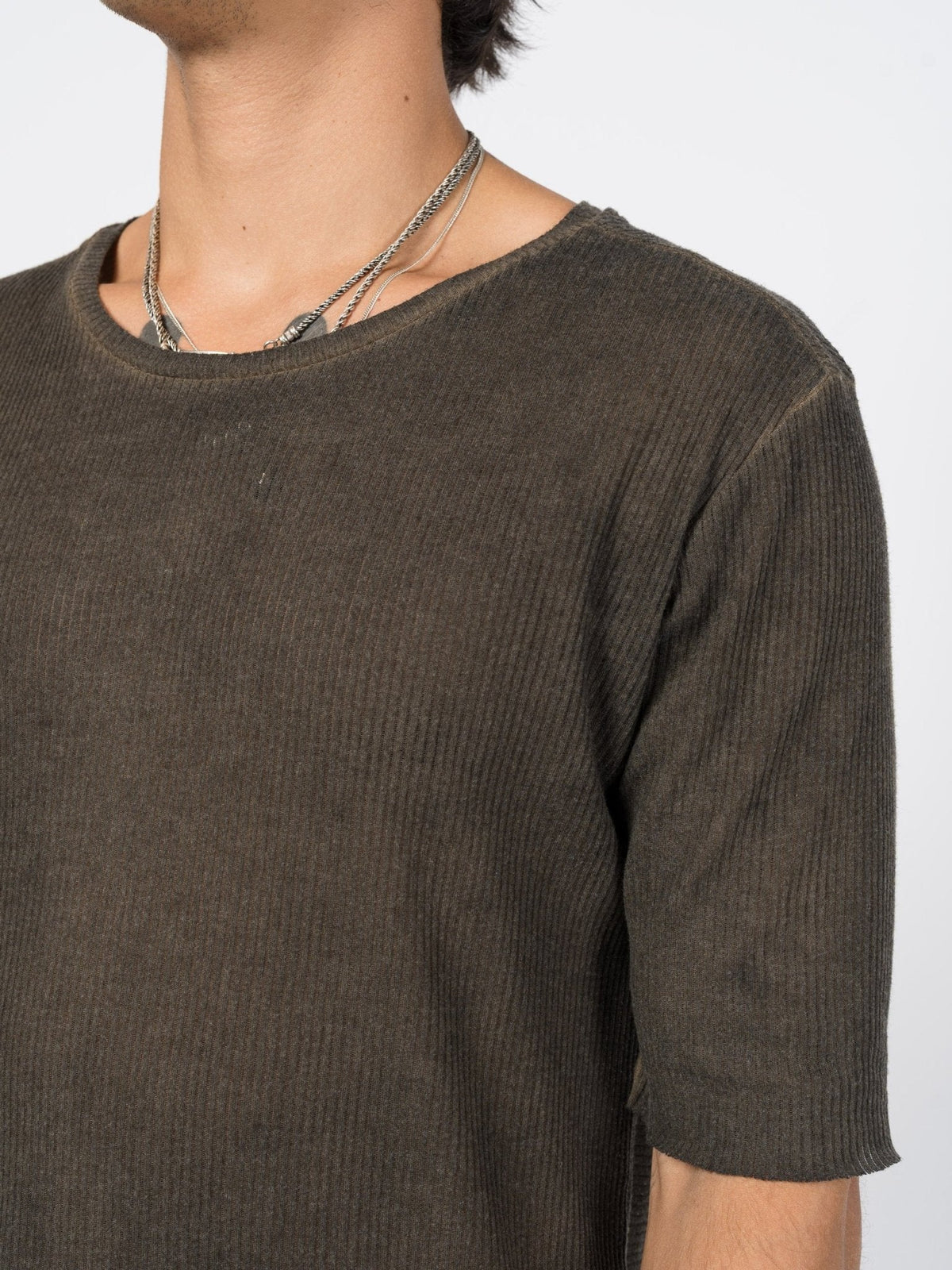 AITO Ribbed Cotton T-Shirt in Charcoal — close-up of the shoulder and chest, fine rib and cloudy, rubbed garment-dye.
