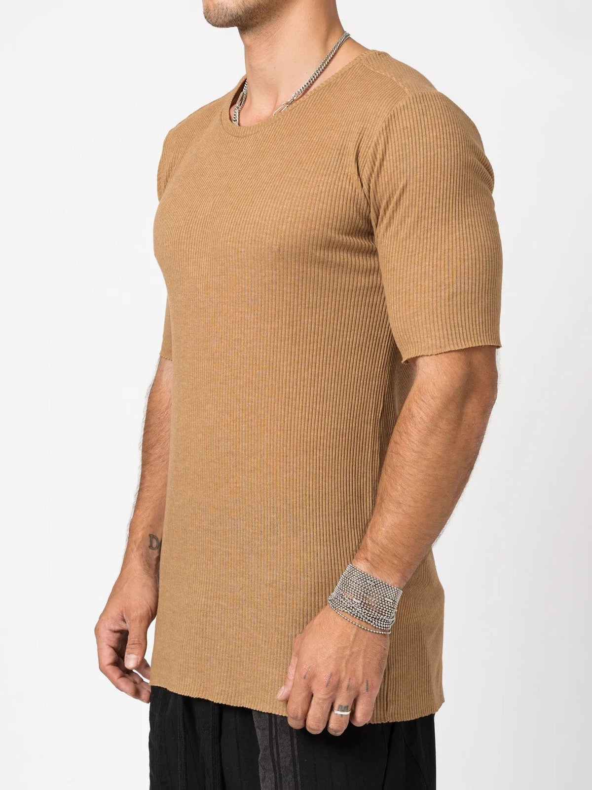 AITO Ribbed Cotton T-Shirt in Moka — side view on model showing the slim, elongated body and raw-cut hem