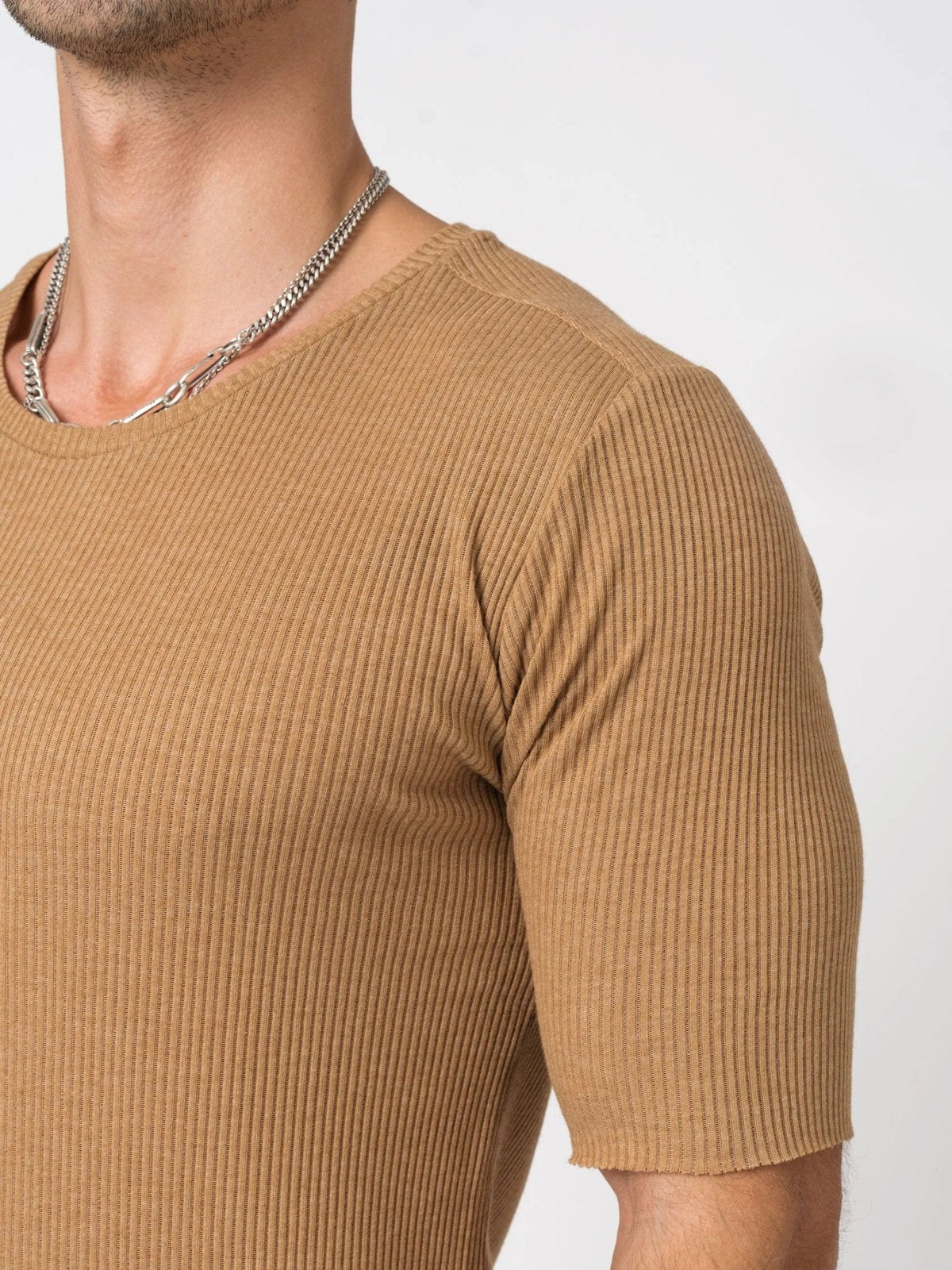 AITO Ribbed Cotton T-Shirt in Moka — close-up of the raw-cut crew neckline and vertical rib texture