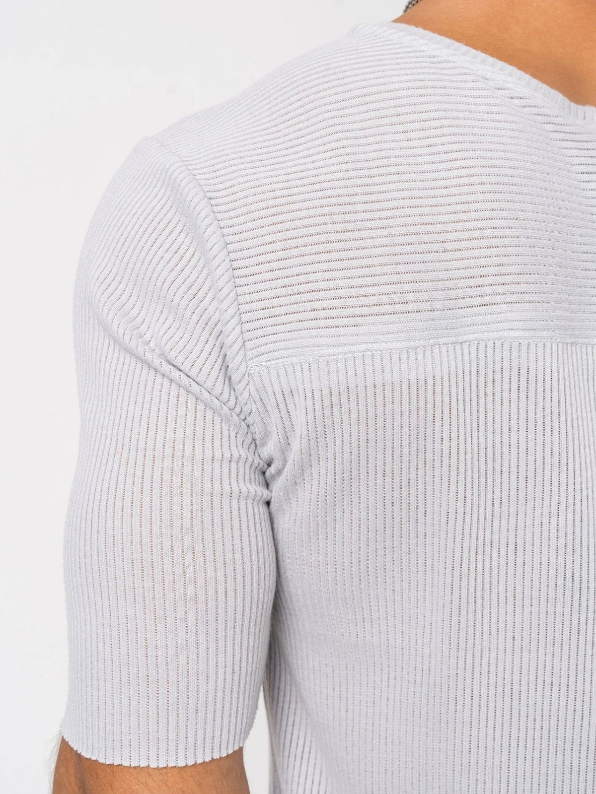 AITO Ribbed Cotton T-Shirt in Light Grey — shoulder detail showing the horizontal-rib yoke, set-in sleeve seam, and half-sheer fine-gauge knit.
