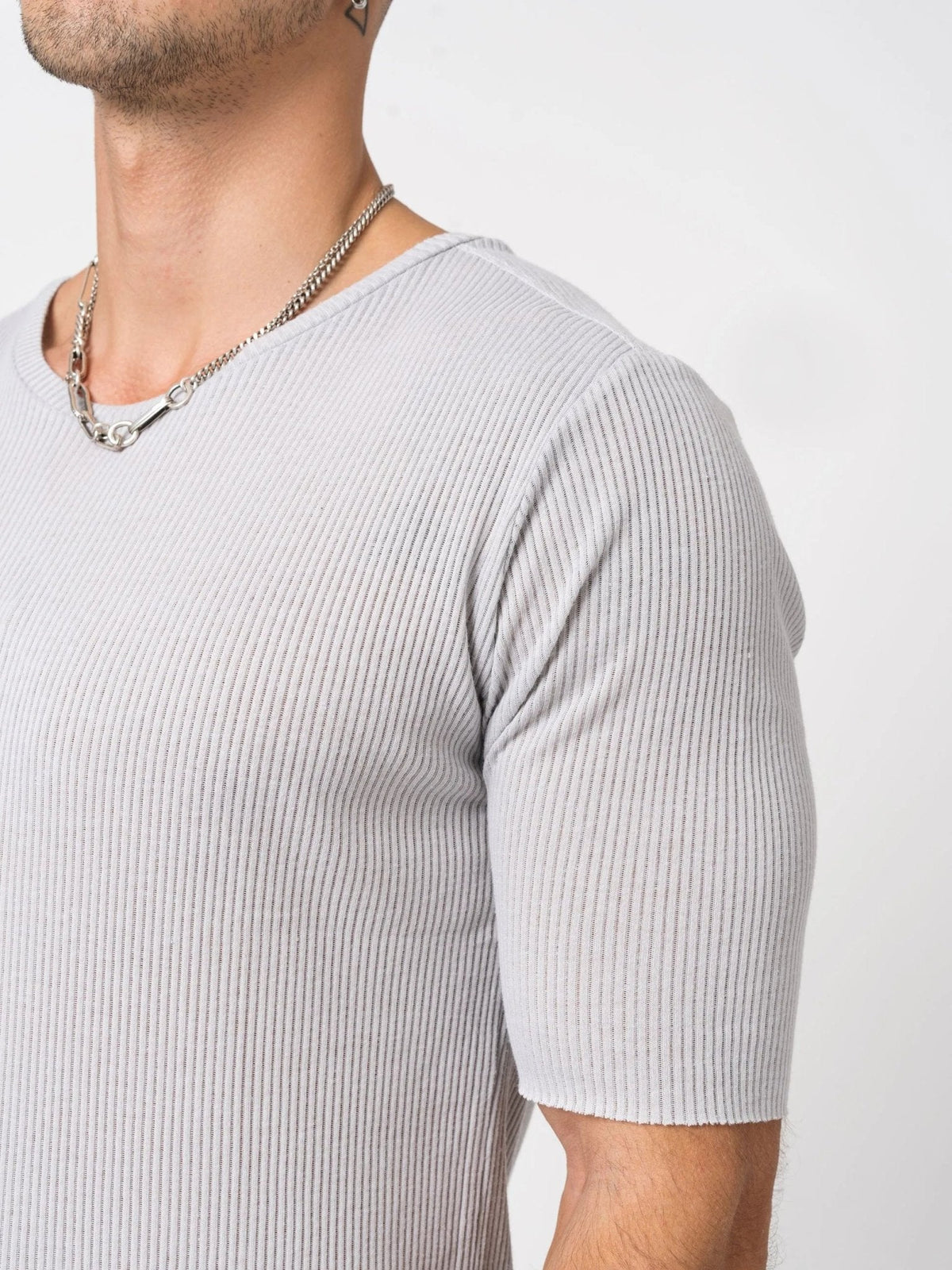 AITO Ribbed Cotton T-Shirt in Light Grey — chest and sleeve detail showing the fine vertical rib and raw-cut sleeve edge.