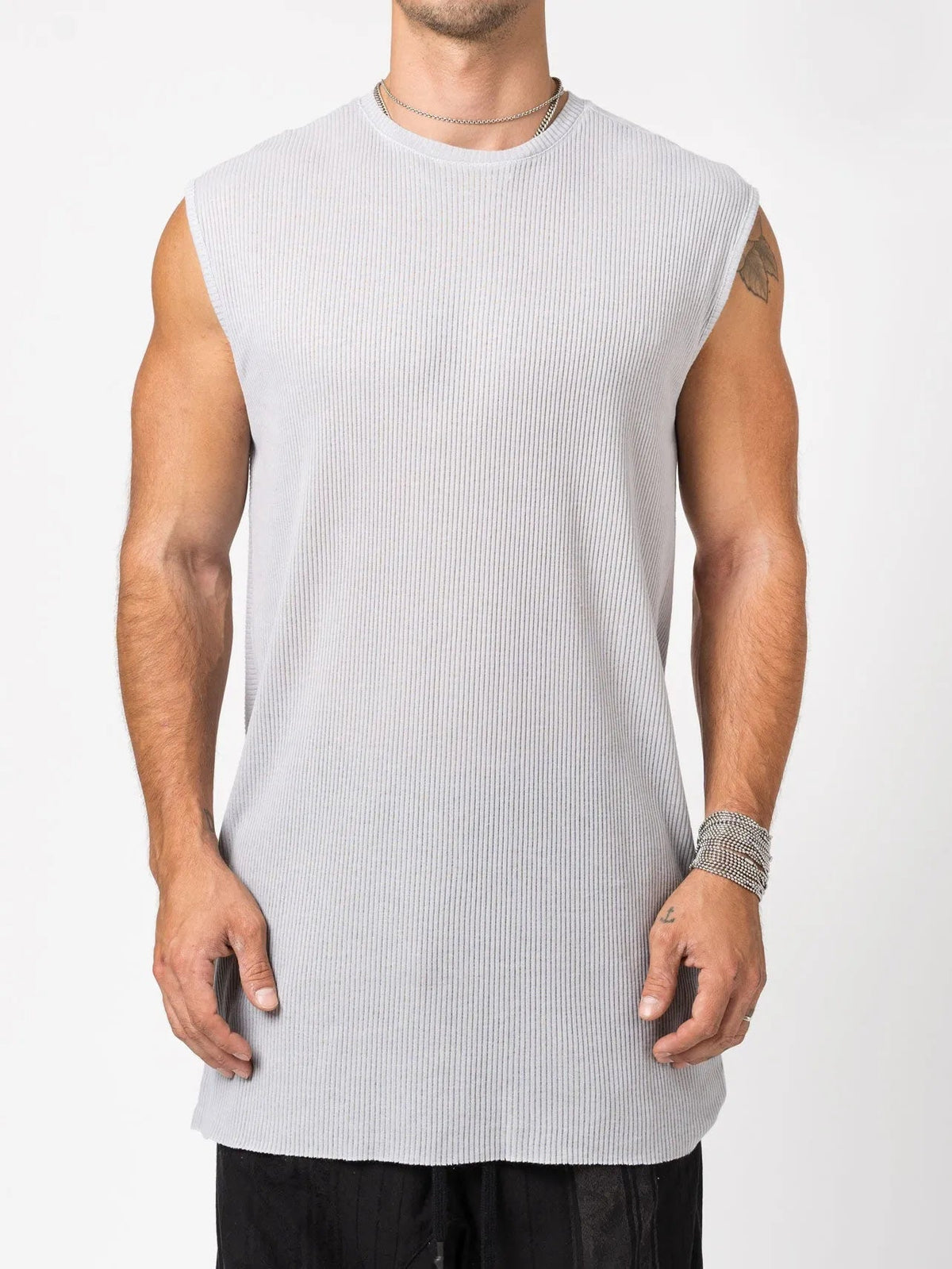 AITO Ribbed Tank Top in Light Grey — front view on model showing the vertical rib and wide-cut bound armholes