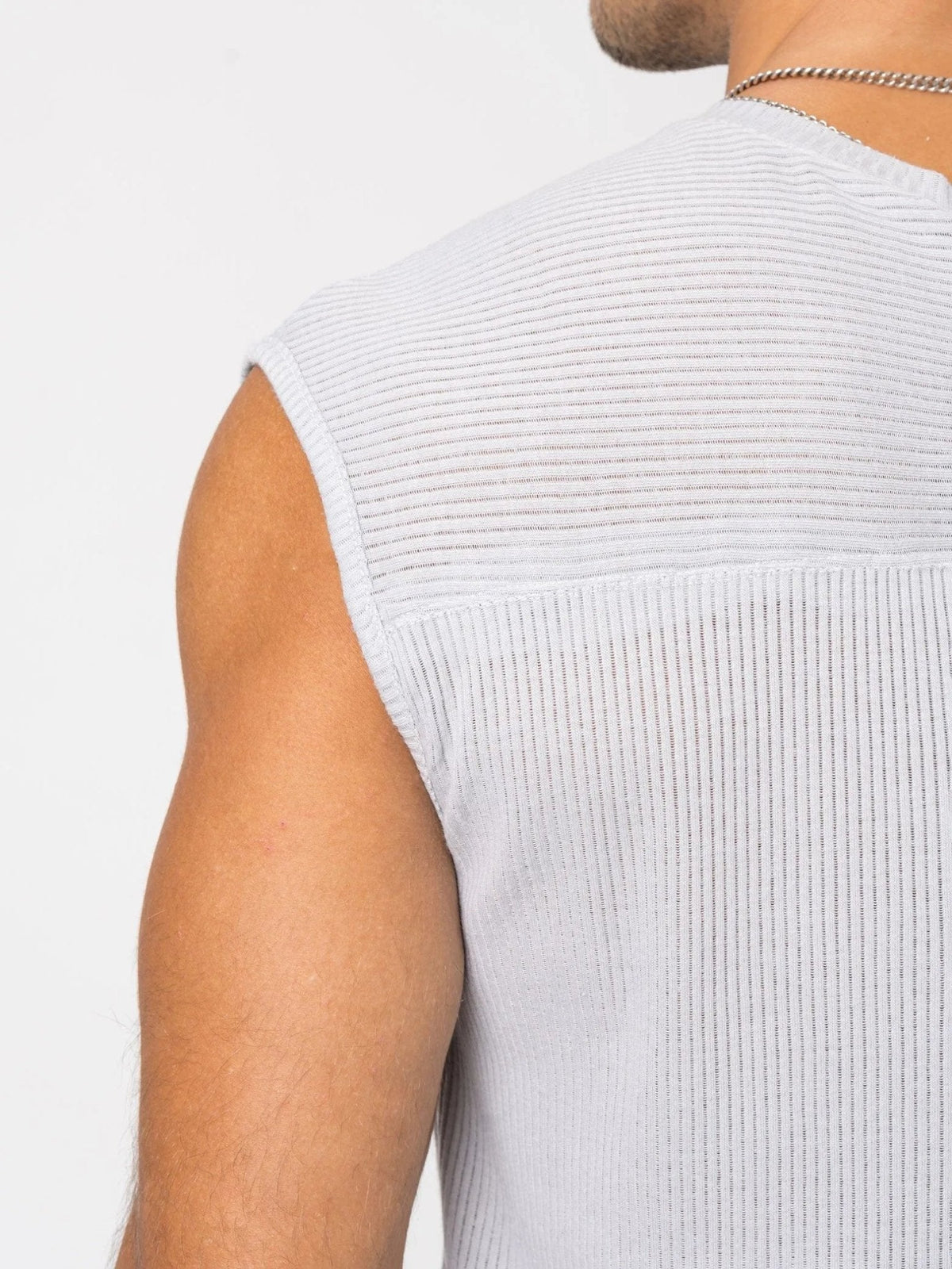AITO Ribbed Tank Top in Light Grey — upper-back detail of the horizontal-ribbed yoke and bound armhole edge