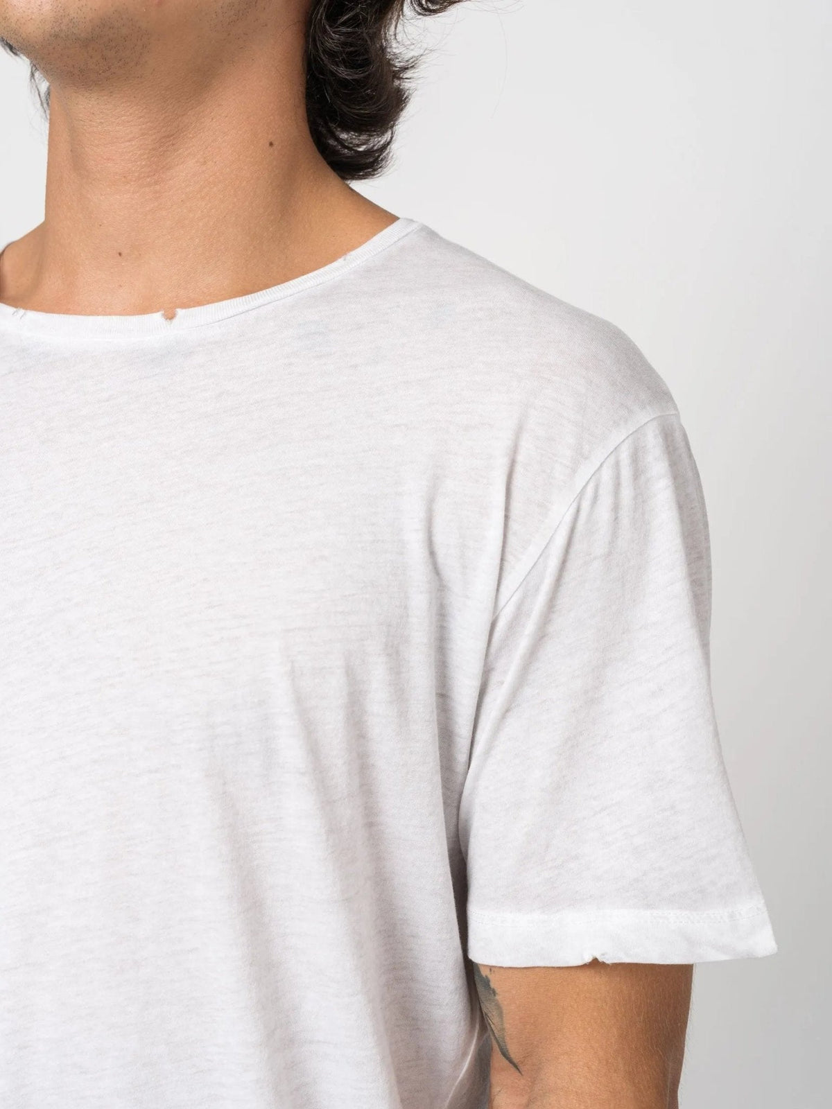 AITO Vintage Washed Cotton T-Shirt in Stone — garment detail on model
