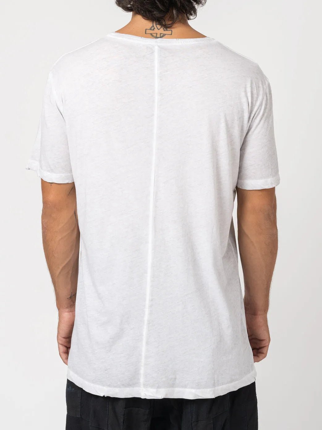 AITO Vintage Washed Cotton T-Shirt in Stone — back view on model, showing the single centre-back seam and slightly sheer knit