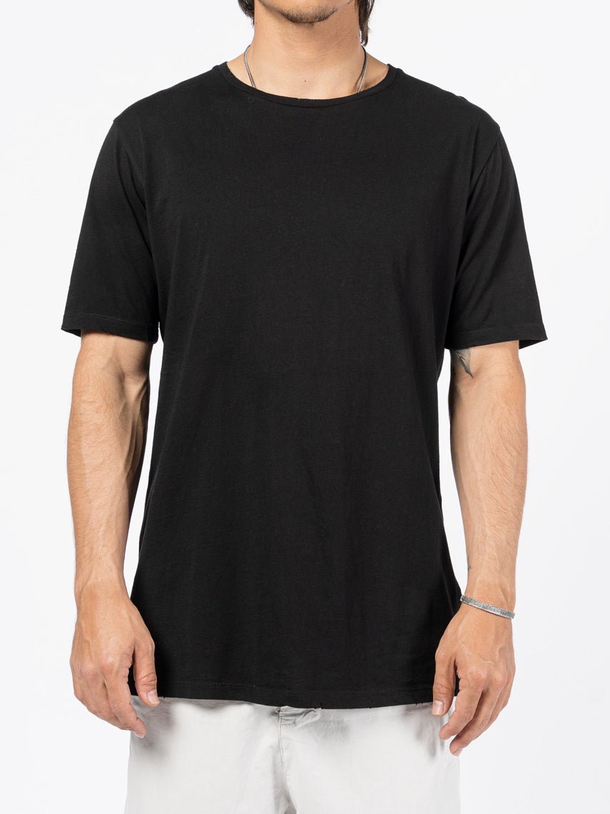 AITO Washed Cotton T-Shirt in Black — front view on model, crew neck and relaxed body from chest to hip