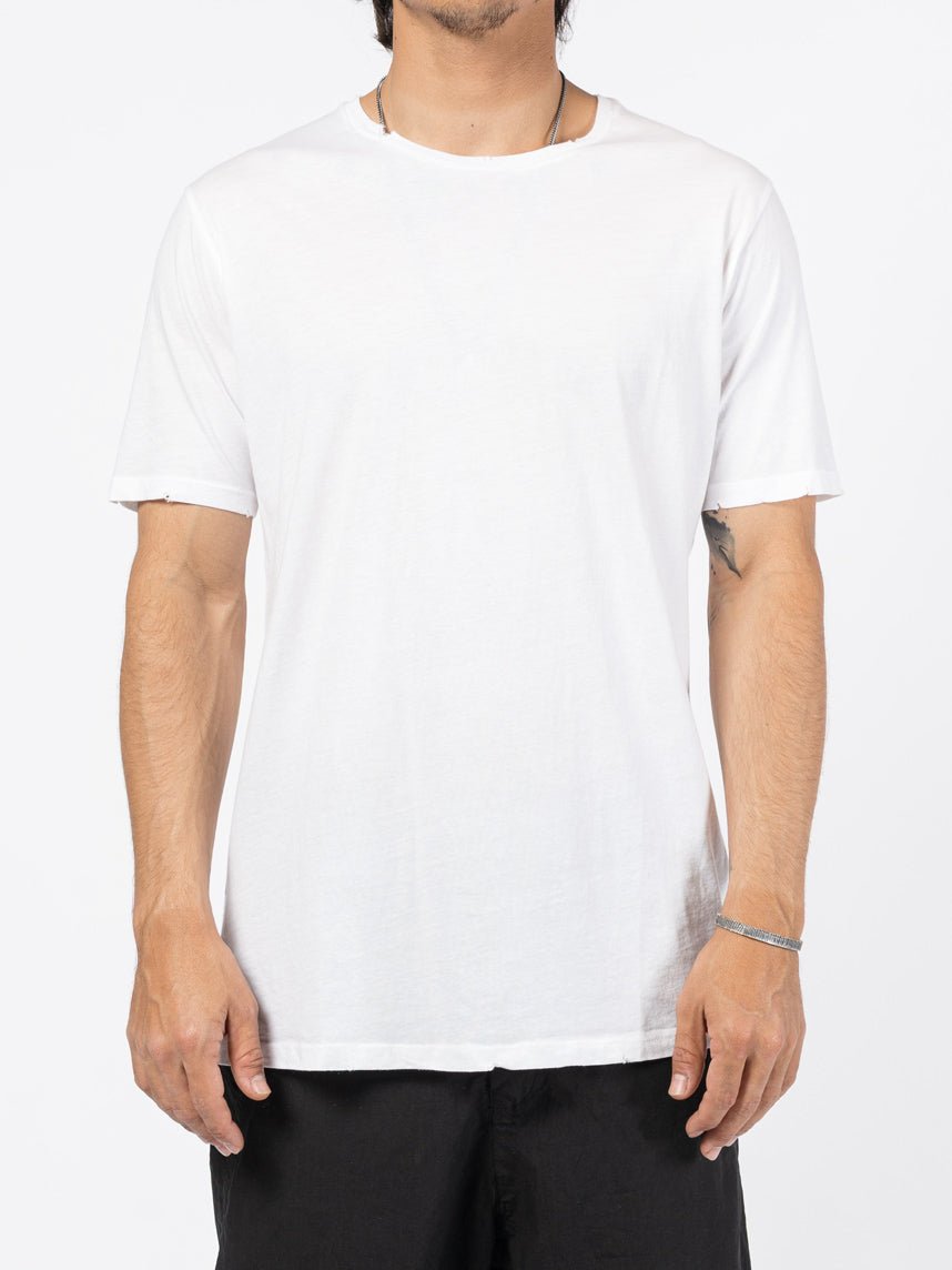AITO Washed Cotton T-Shirt in White — front view on model showing the raw, lightly frayed round collar and sleeve edges